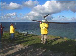 Pilot Espen Torp from Norway and his German starthelper Stefan Eder prepare for starting